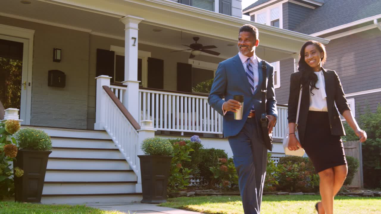 Business Couple With Son Leaving House For Work And School