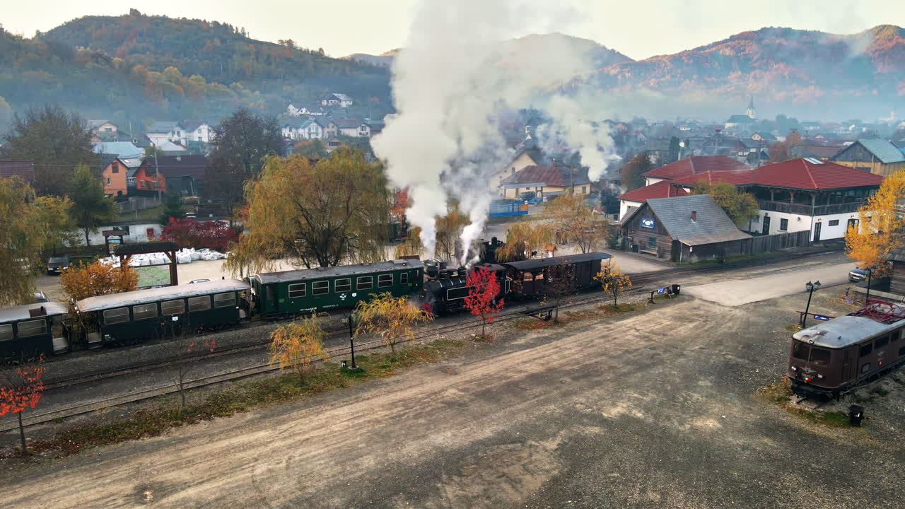 Aerial drone view of the wound-up steam train Mocanita at the railway station in Viseu de Sus, Romania
