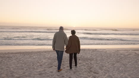 walking, beach and senior couple holding hands by