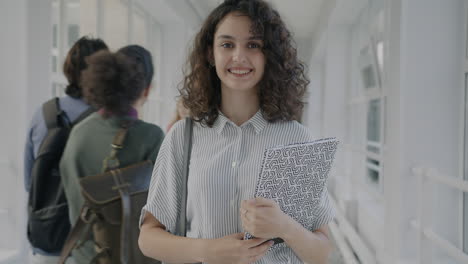 student walking in a university hallway