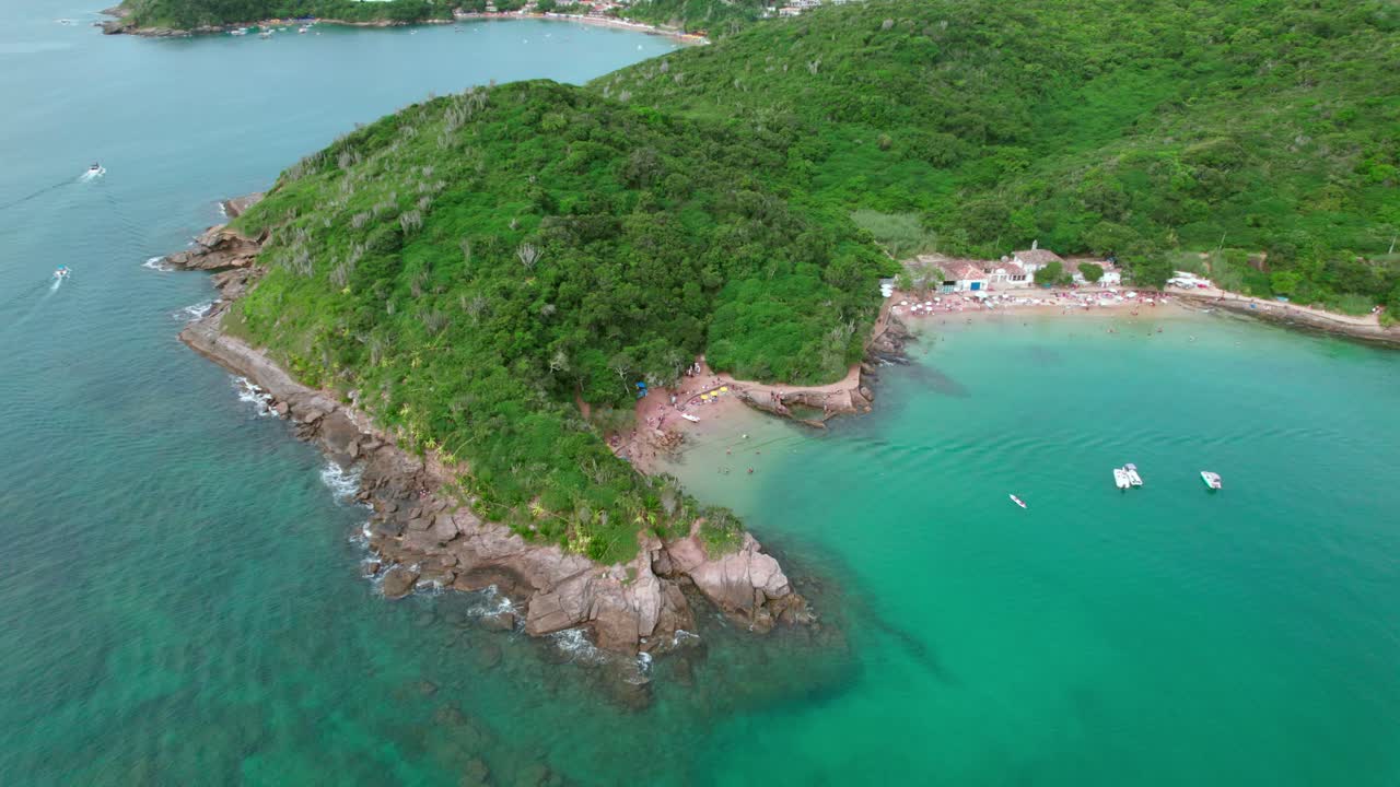 Aerial orbiting shot over idyllic turquoise Azeda and Azedinha beach, B&uacute;zios
