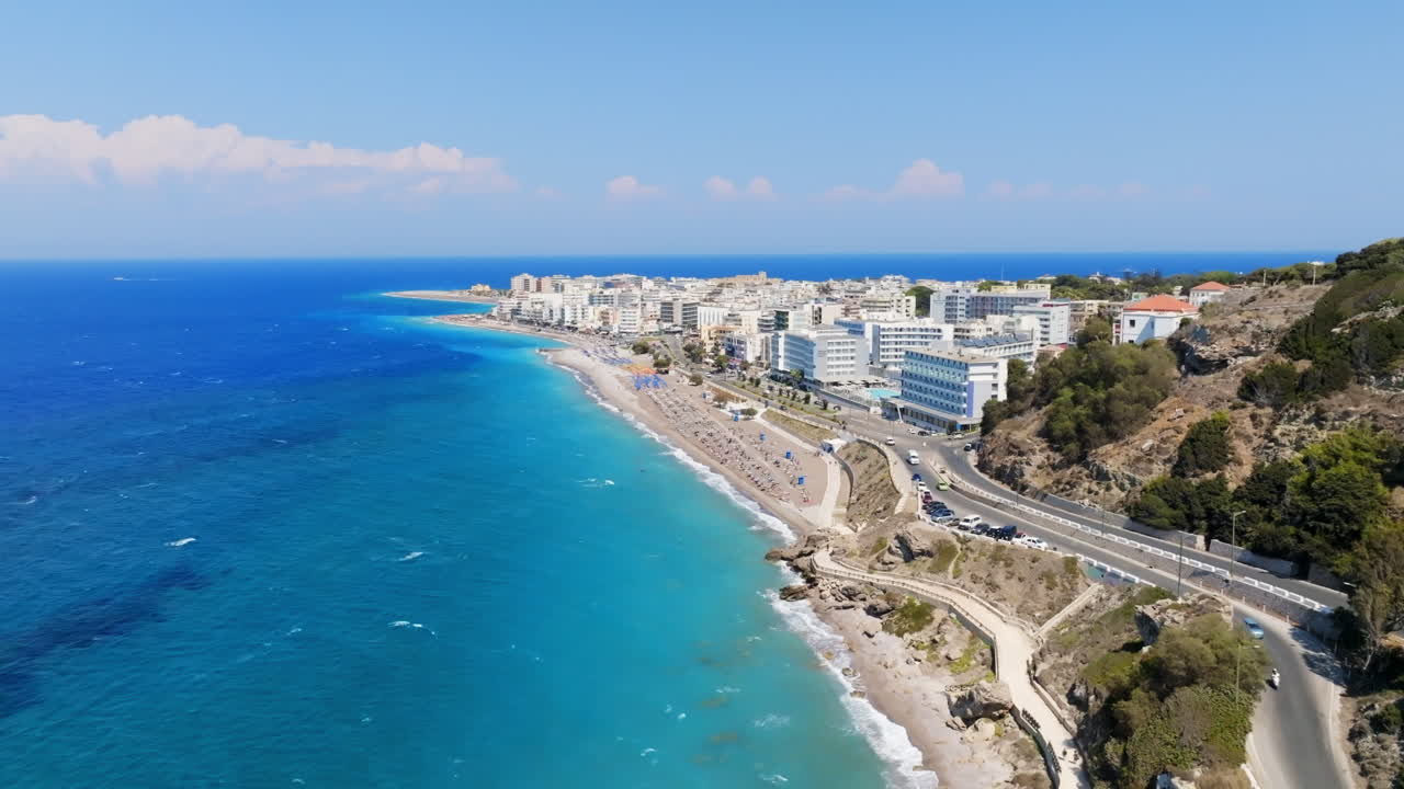 AERIAL: Road and beaches in front of downtown Rhodes, sunny day in Greece