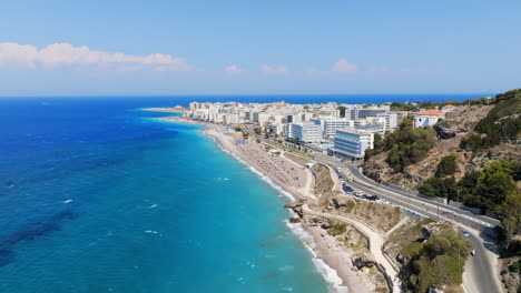 aerial: road and beaches in front of downtown rhodes, sunny day in greece