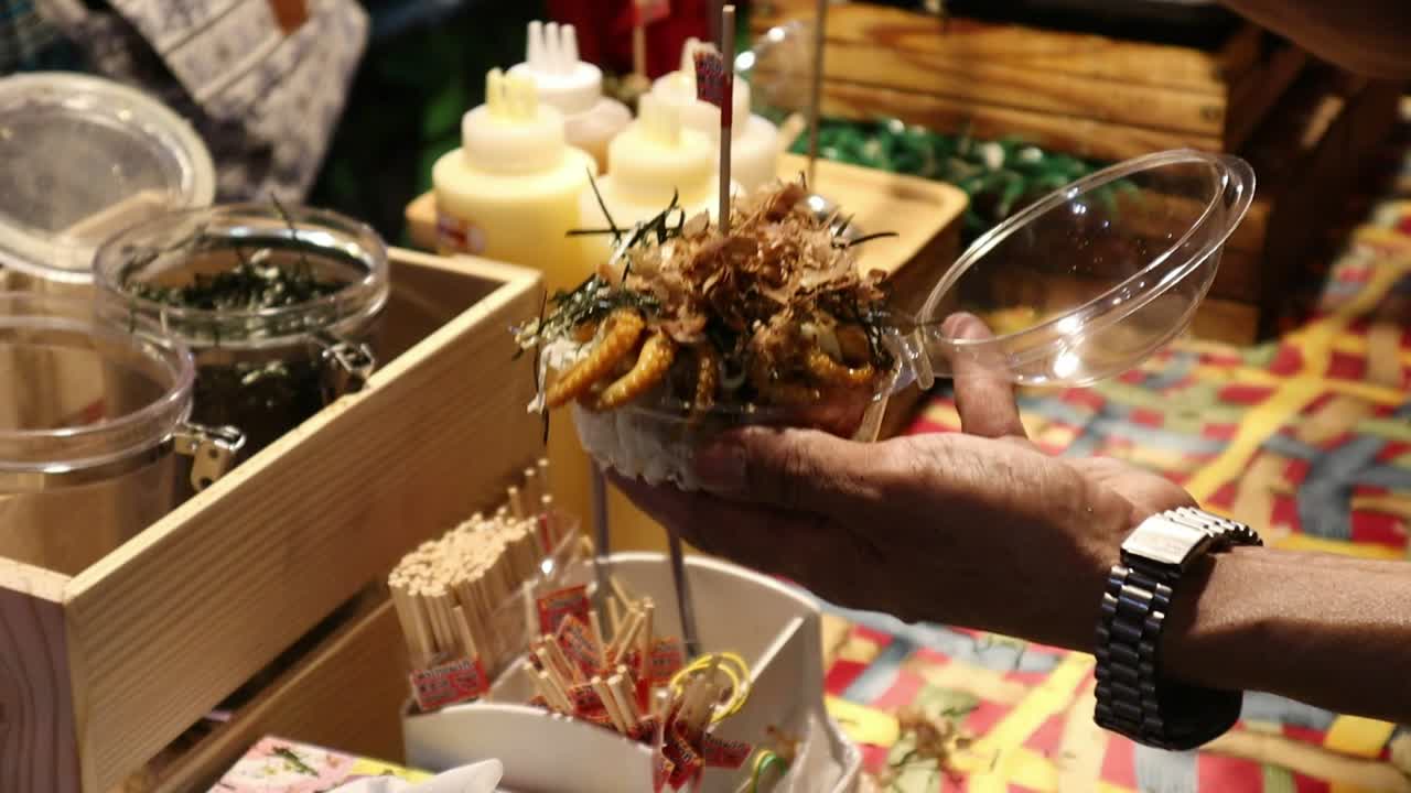Popular Saturday Night Market Street Food in Chiang Mai, Thailand. Thai Takoyaki street food made with fresh seafood. A lively and fun night market.