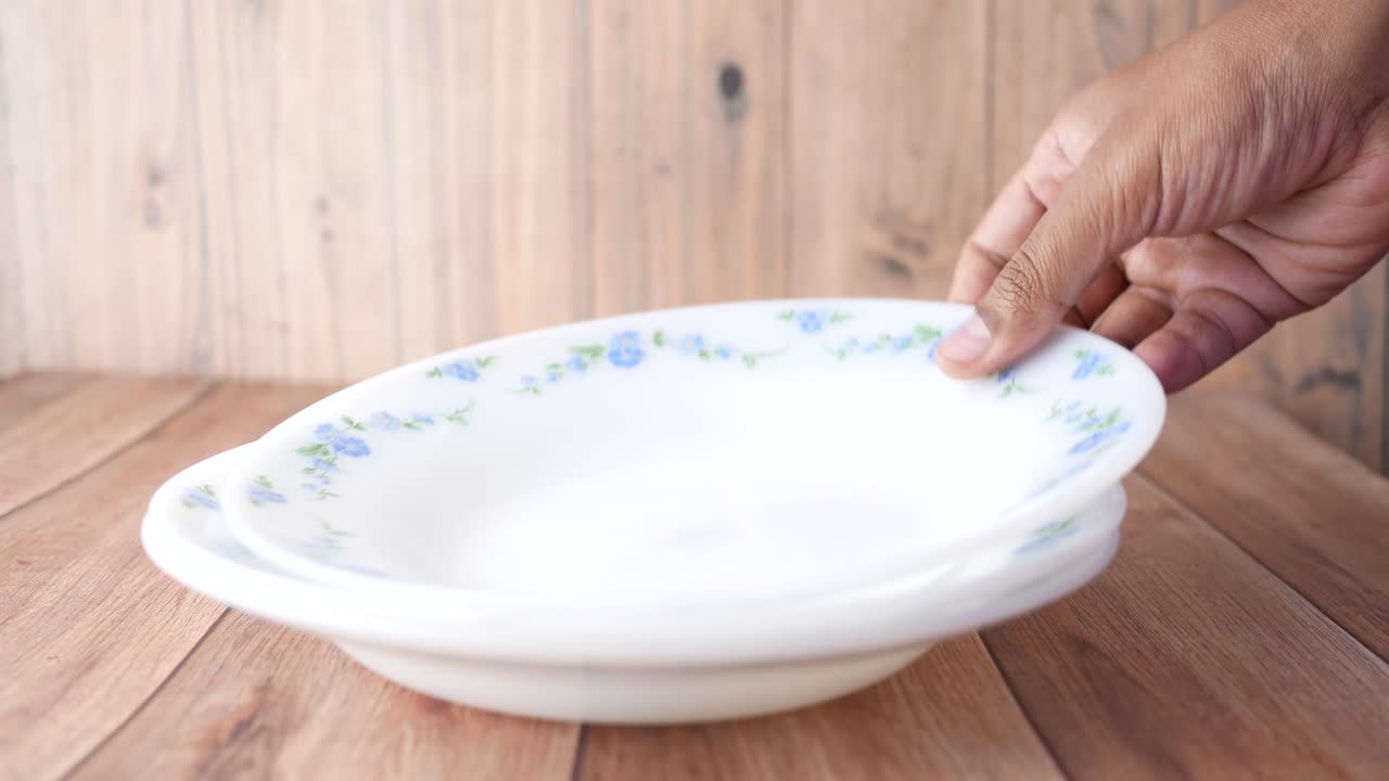 Vintage Floral Design Plates on Wooden Table