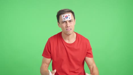 man cheering for south korea during a match that is lost