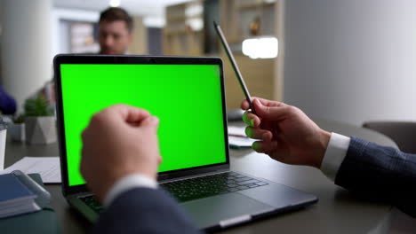 unrecognizable financial employee using laptop