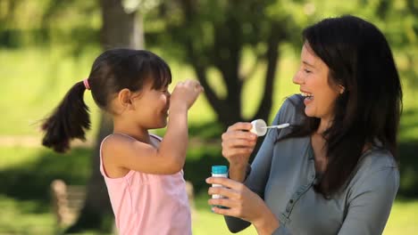 Mom-and-daughter-blowing-bubbles