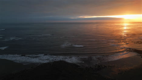 establishing aerial drone shot of stunning sunrise at cleveland way in north yorkshire at low tide