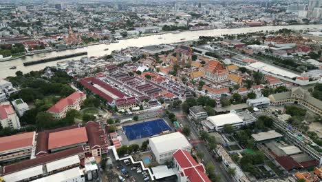 aerial view of the grand palace and chao phraya river in bangkok, thailand