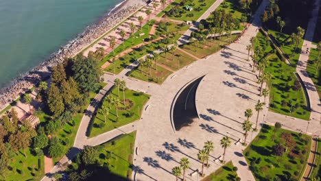 Flying-above-landscape-design-park-nearby-Black-sea-beach