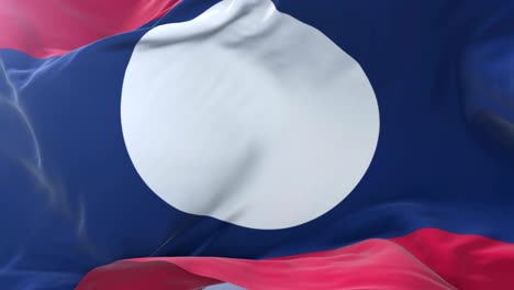 laos flag waving at wind with blue sky in slow, loop