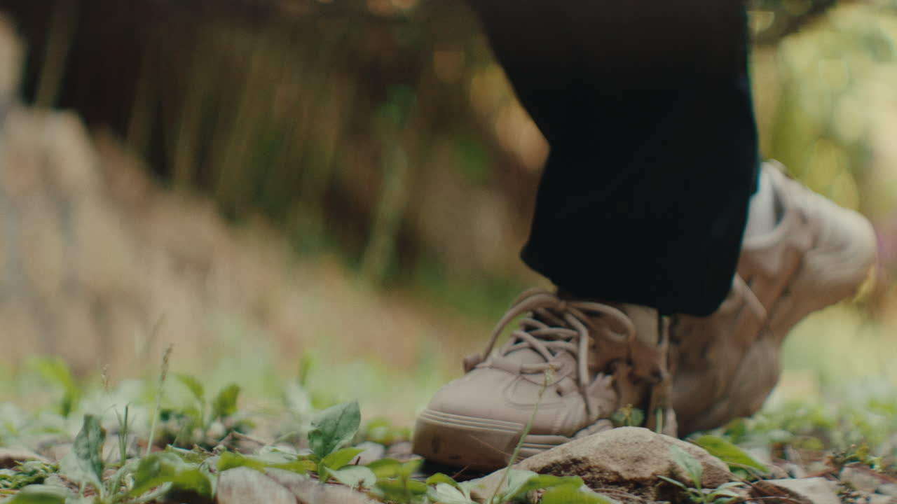 Person wearing sneakers outdoors