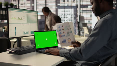 Businessman working on laptop in office