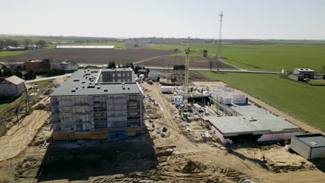 work in progress on building construction site in lubawa poland, aerial side movement