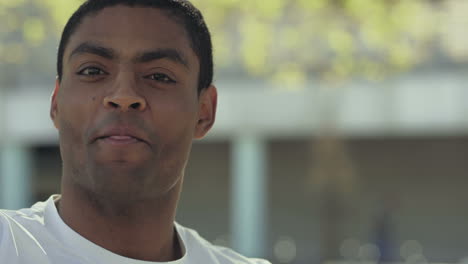 Smiling-young-man-talking-to-camera.