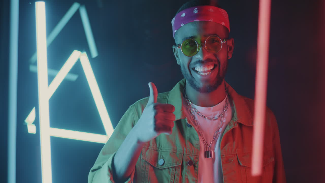 Stylish Man Posing in Neon Lights