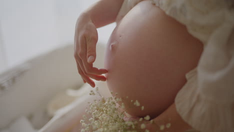 Pregnant Woman Touching Baby Bump Lovingly