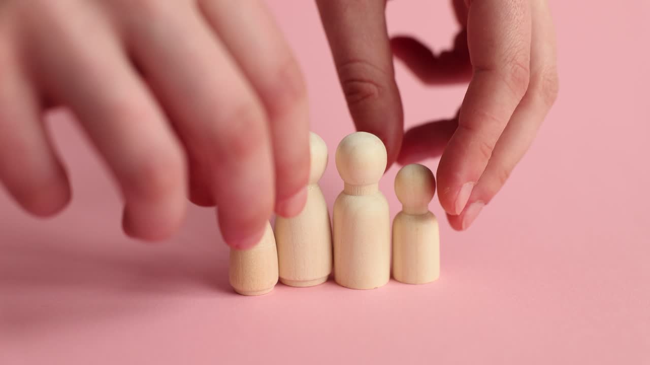 Wooden peg dolls representing community and family