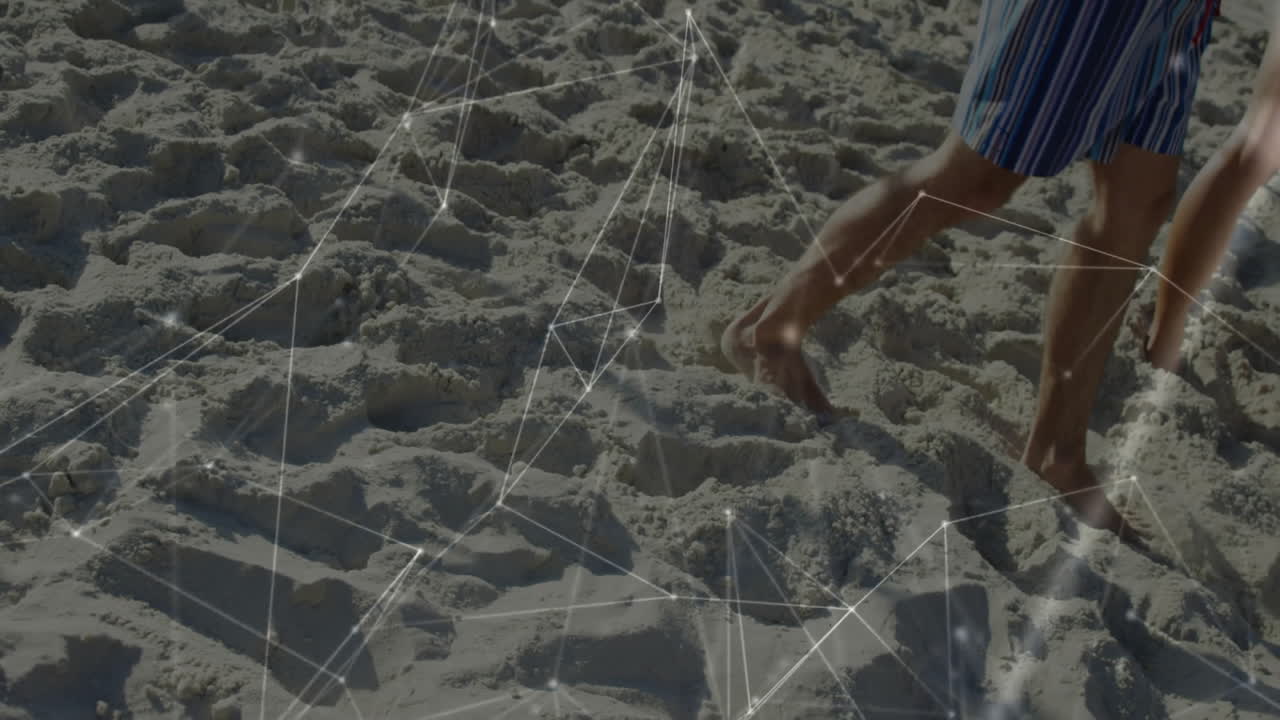 Person walking on sandy beach with network connections animation overlay