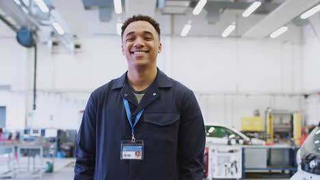 Portrait-Of-Male-Student-Studying-For-Auto-Mechanic-Apprenticeship-At-College