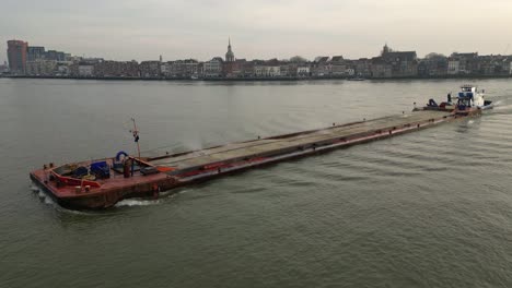 Empty-cargo-ship-sailing-on-the-river