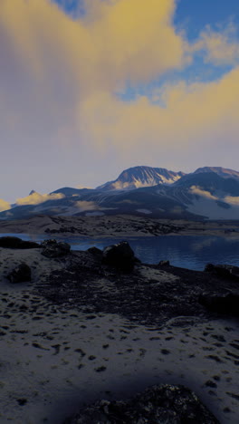 majestic mountain range with snow-capped peaks and a tranquil lake