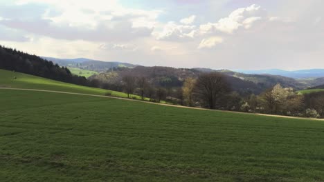 aerial view of beautiful german landscape with lushes green hills and hay fields