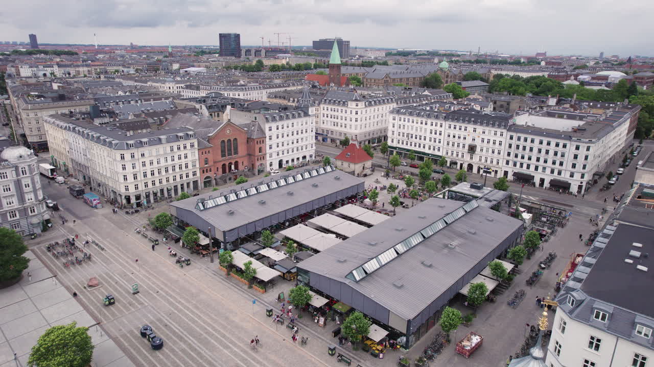 Torvehallerne is surrounded by the vibrant city life near N&oslash;rreport in central Copenhagen
