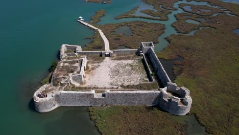 medieval fortress at the entrance of butrint's ancient city, a historical marvel in the archaeological site, lagoon guardian