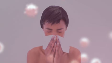 animation of virus cells over biracial woman sneezing