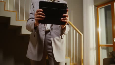 woman using tablet in a living room