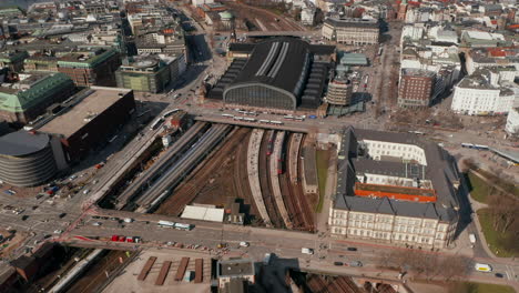 Aerial-view-of-trains-arriving-at-Hamburg-main-train-station-in-urban-city-center