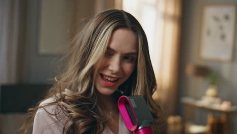 Woman Using Hair Dryer at Home