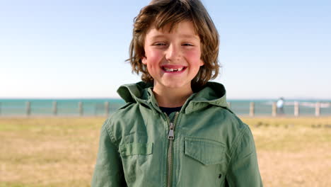 happy, smile and face of child at the beach having