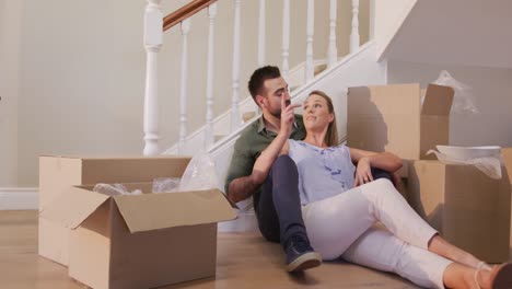 Caucasian-attractive-couple-moving-into-new-house