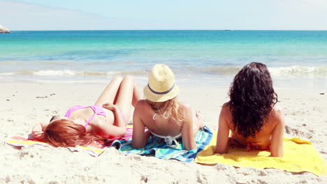 friends lying on the beach