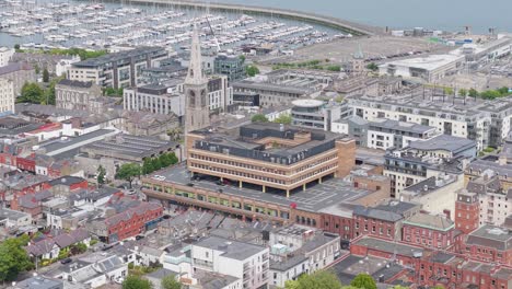 aerial views of historic churches and modern living in dún laoghaire, ireland