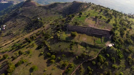 aerial approaching kuntur wasi historic stone vestige in peru highland