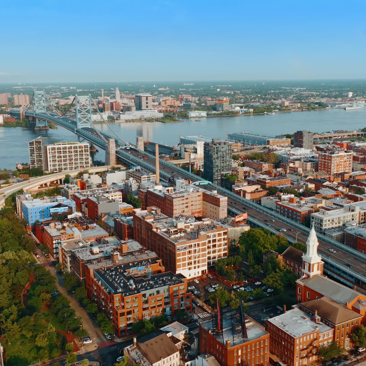 The Benjamin Franklin Bridge over Delaware River. Urban landscape of Philadelphia on sunny day. Top view
