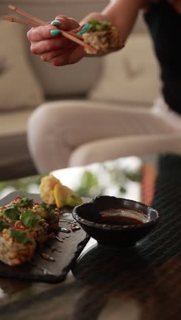 woman eating sushi