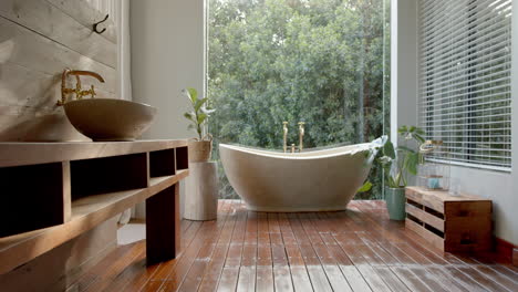 a modern bathroom features a freestanding bathtub and a wooden vanity with a vessel sink