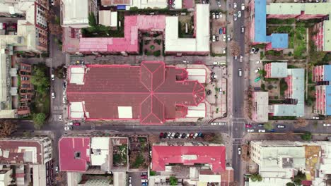 Top-view-truck-left-of-an-old-neighborhood-in-Santiago-Chile-with-the-worn-basilica-Salvador-which-is-in-the-process-of-being-restored