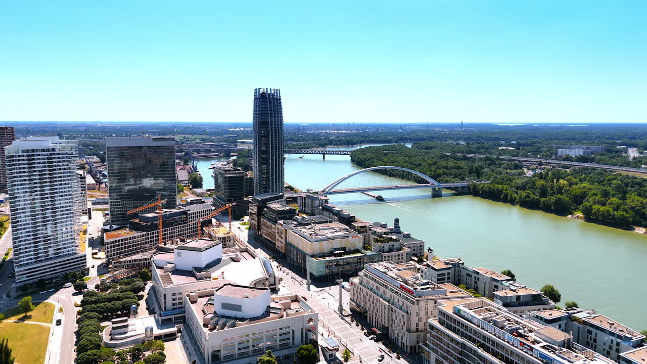 Modern multi-storied buildings at the waterfront of the Danube River. Contemporary Bratislava, Slovakia panorama. Aerial view