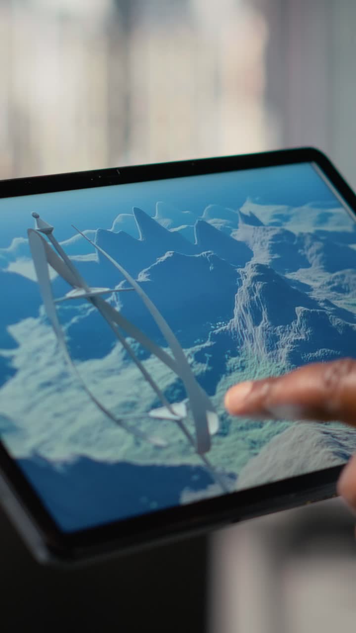 Close up of engineer working on futuristic vertical wind turbine CAD design