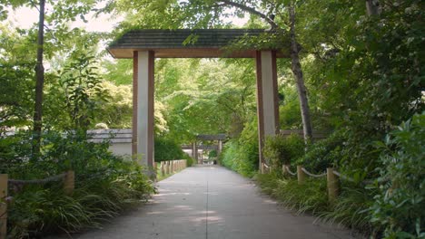 steady shot of 5 continents park jacques chirac with chinese architectural gate monument in levallois, france