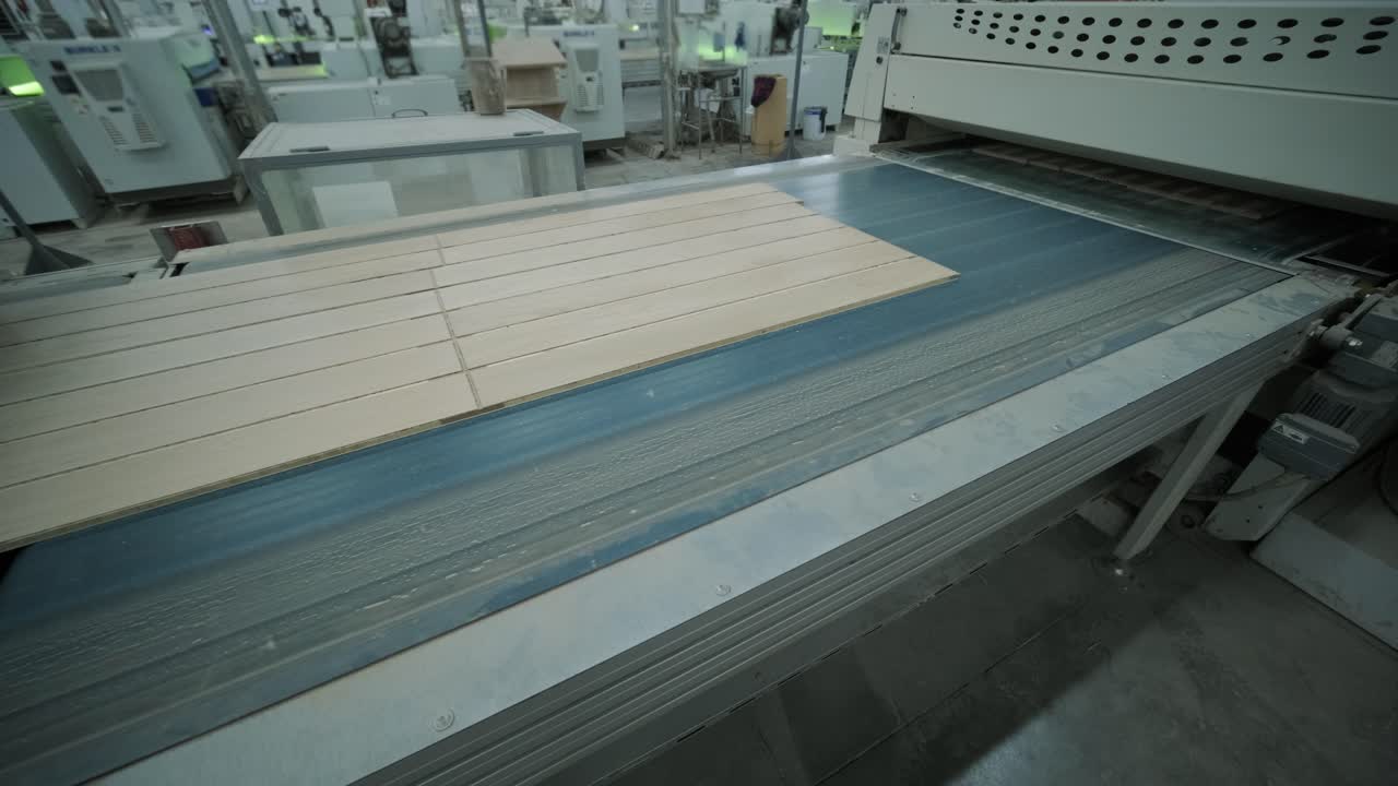 Wooden Panels Moving on an Automated Conveyor Belt in a Factory