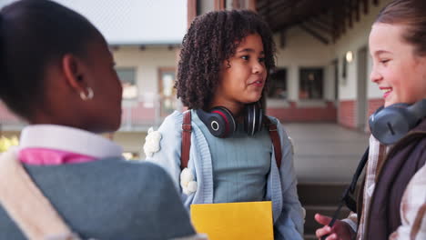 students talking in schoolyard