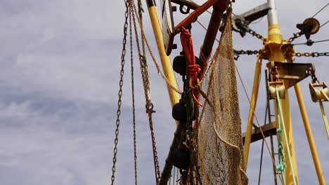 boat mast with fishing net and many women and ropes in the north of germany