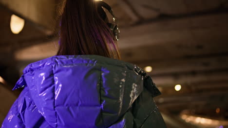 Girl-teenager-walking-subway-listening-music-by-wireless-earphones-close-up.